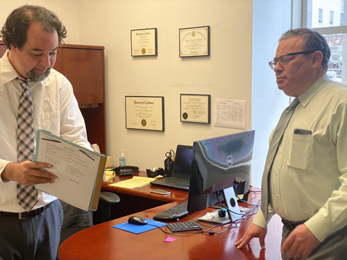 Senior Associate attorney Clint C. Christoffersen discussing a case with David J. Cohen, founder of Bay Area Criminal Lawyers, PC.